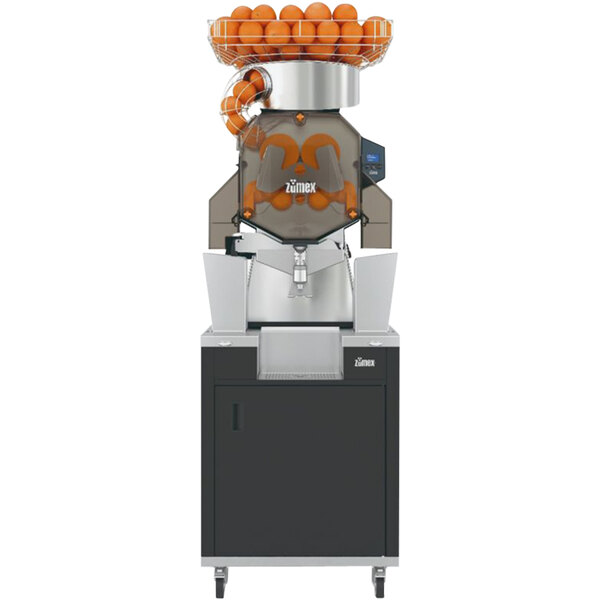 A Zumex Speed S+ juicer with oranges in a basket on top.