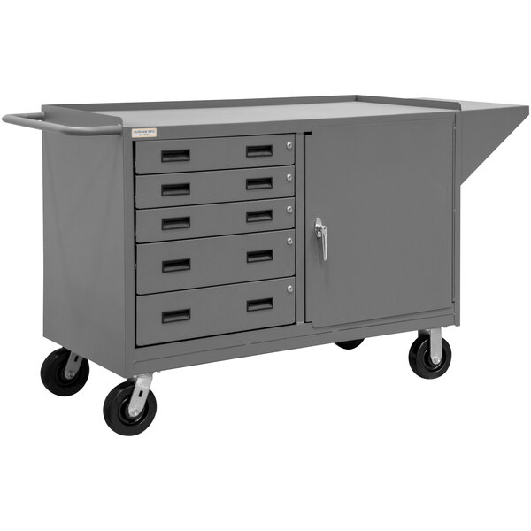 A grey mobile steel workstation with drawers and a shelf.