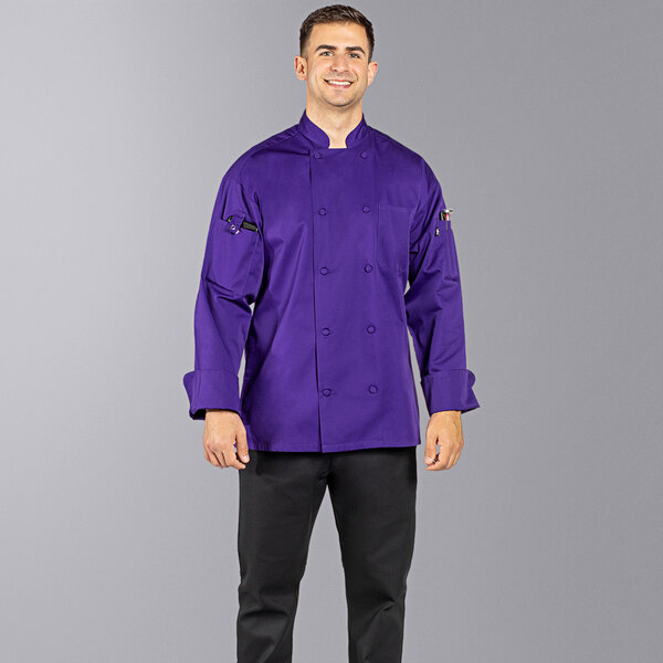 A man wearing a grape purple Uncommon Chef long sleeve chef coat.