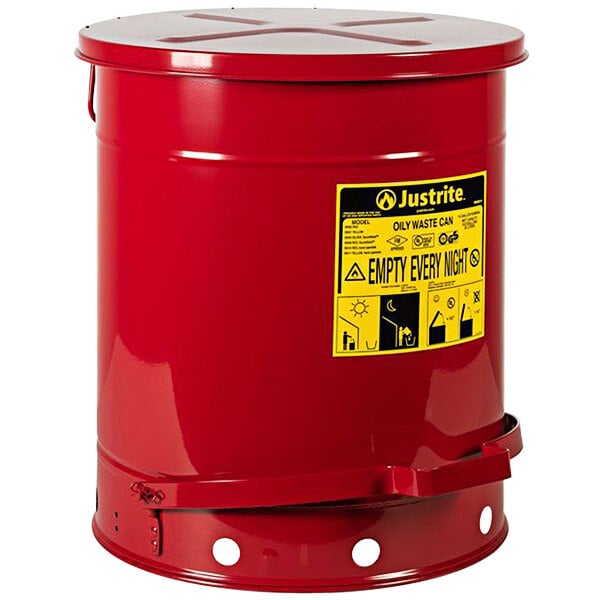 A red Justrite oily waste can with a yellow label.