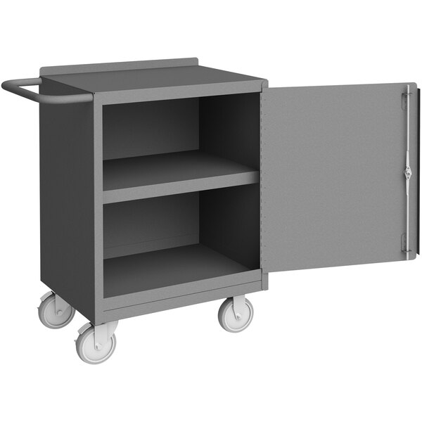 A grey metal mobile workstation with a door open.