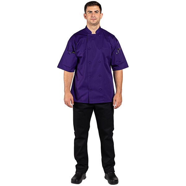 A man wearing a purple Uncommon Chef short sleeve chef coat.