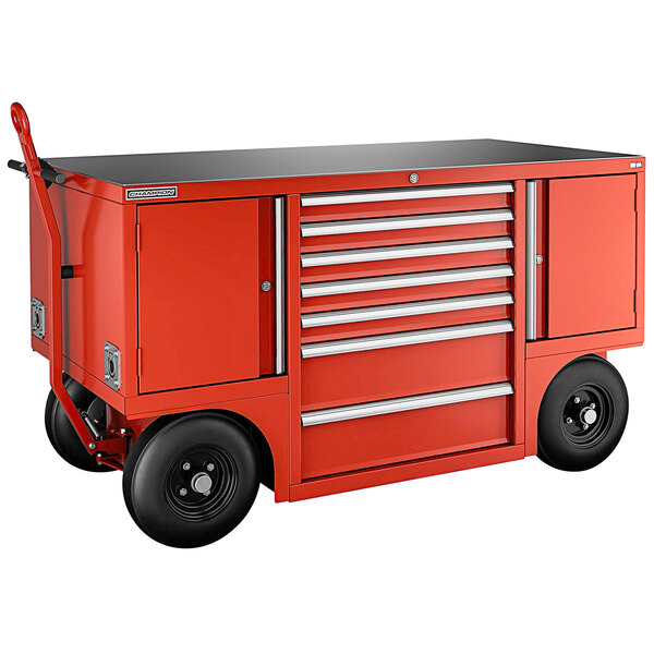 A red Champion Tool Storage mobile workshop with drawers and lockers on wheels.