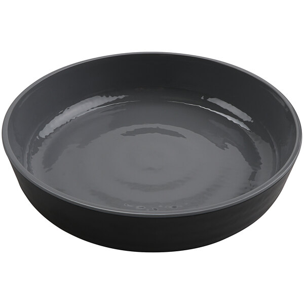 A gray melamine low bowl with a white rim.