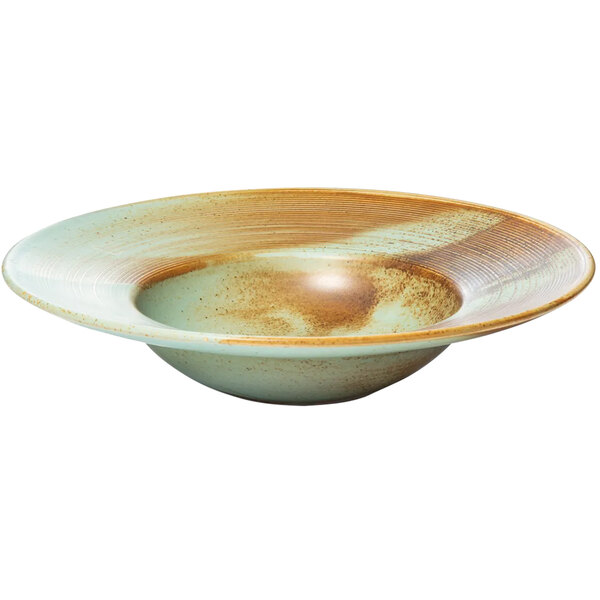 A close up of a Bon Chef Tavola Lago porcelain pasta bowl with brown specks.