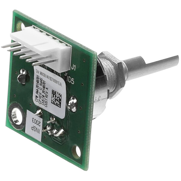 A close-up of a small green and silver Solwave control board encoder.