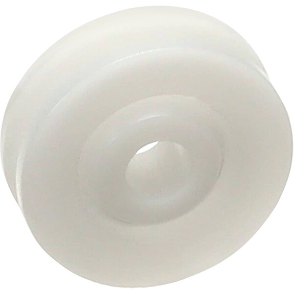 A white plastic wheel with a hole in the middle.