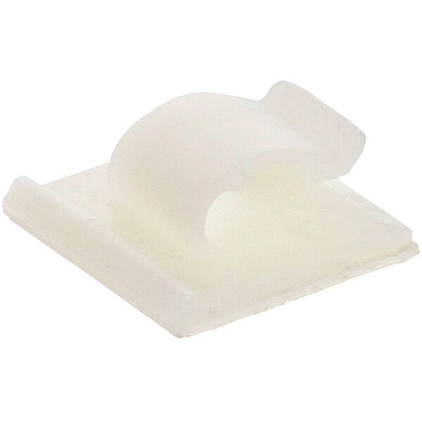 A white plastic clip with a small hole.