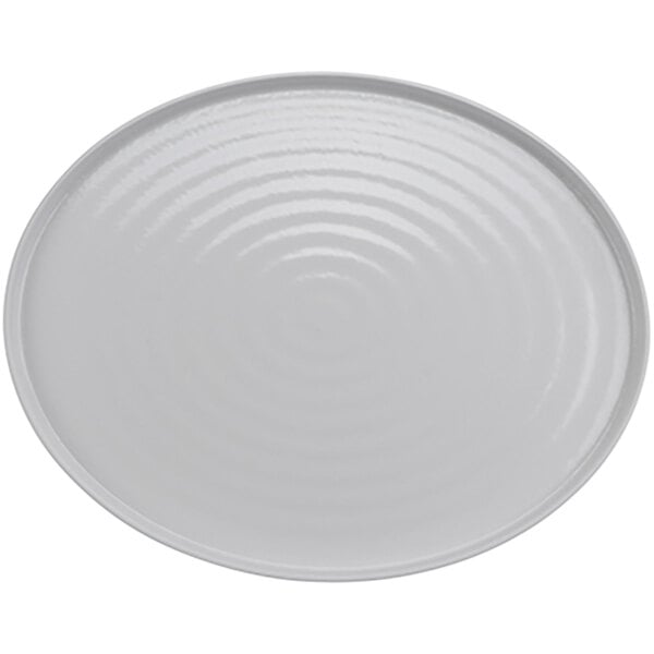 A white oval platter with a spiral pattern on the surface.