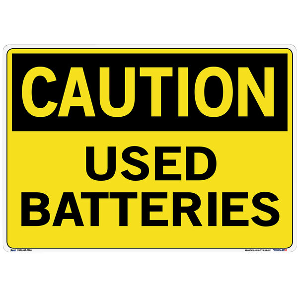 A yellow decal sign with the words "Caution / Used Batteries" in yellow text on a black background.