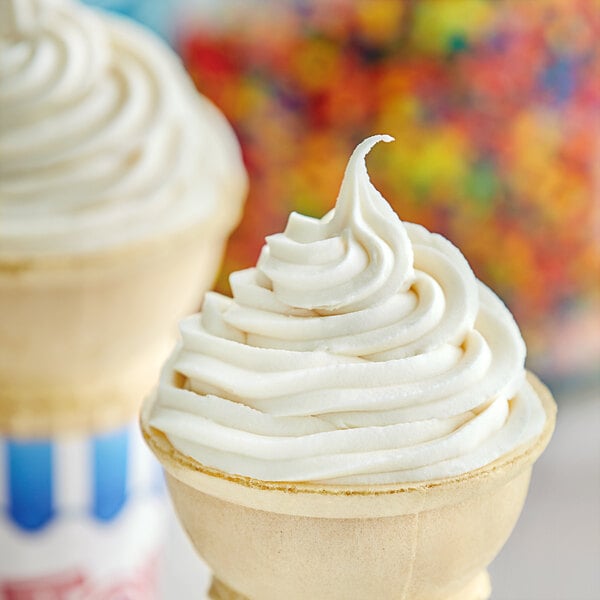 A close-up of two white ice cream cones.