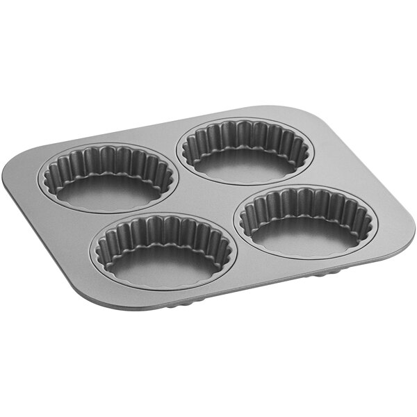 A Baker's Mark fluted tartlet and quiche pan with four compartments.