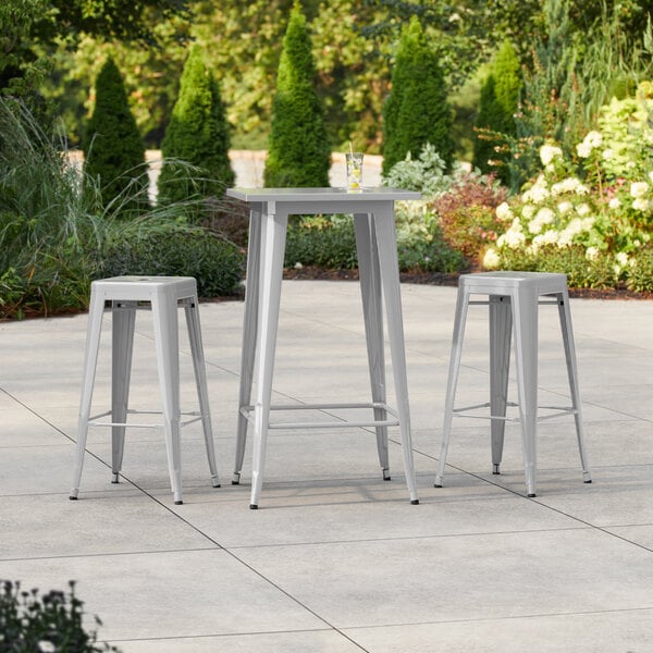 Lancaster Table & Seating Alloy Series 23 1/2" x 23 1/2" Silver Bar Height Outdoor Table with 2 Backless Barstools