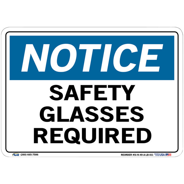 A white sign with blue and black text that says "Notice Safety Glasses Required"