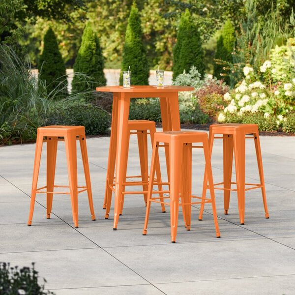 Lancaster Table & Seating Alloy Series 30" Round Orange Bar Height Outdoor Table with 4 Backless Barstools