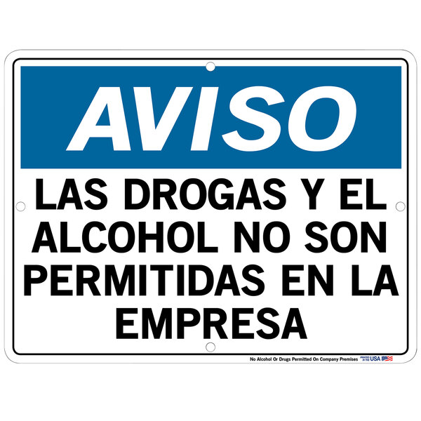 A blue and white aluminum warehouse sign with black text that says "Aviso: Los Drogas Y El Alcohol No Son Permitidas En La Empresa"