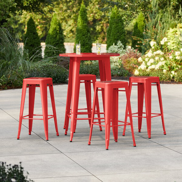 Lancaster Table & Seating Alloy Series 30" Round Ruby Red Bar Height Outdoor Table with 4 Backless Barstools