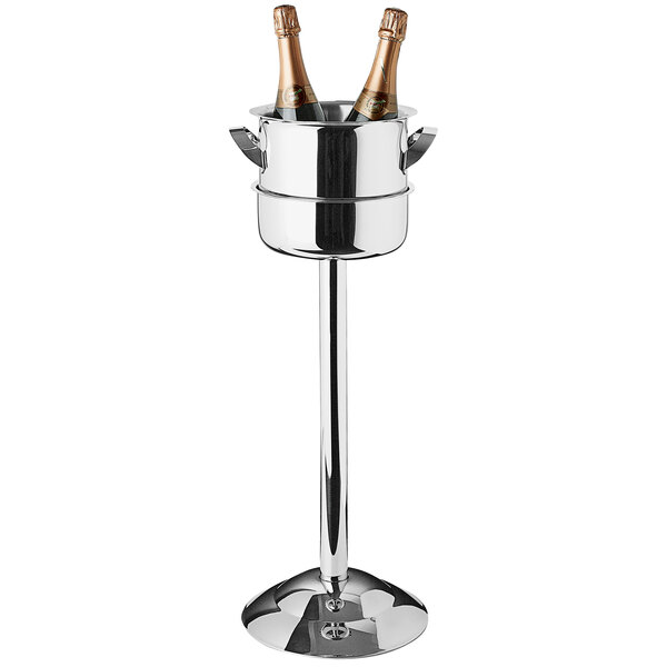 A Franmara stainless steel wine cooler on a metal stand with a champagne bottle inside.