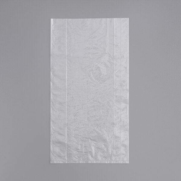 A white plastic bag on a gray surface.