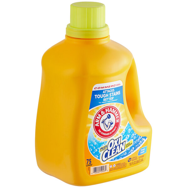 An Arm & Hammer yellow bottle of liquid laundry detergent with a white label.