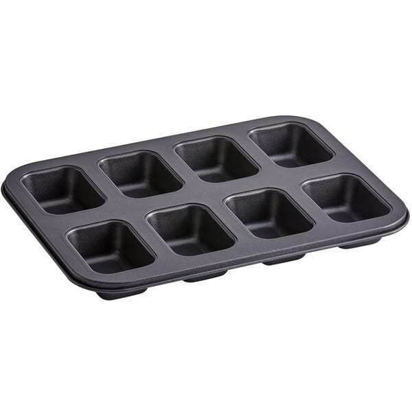 Baker's Mark 8 Compartment Non-Stick Carbon Steel Mini Bread Pan - 5 oz.  Capacity, 3 5/8 x 2 3/8 x 1 3/8 Cavities