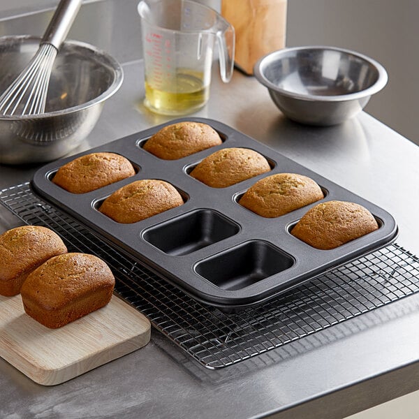 Baker's Mark 8 Compartment Non-Stick Carbon Steel Mini Bread Pan - 5 oz.  Capacity, 3 5/8 x 2 3/8 x 1 3/8 Cavities