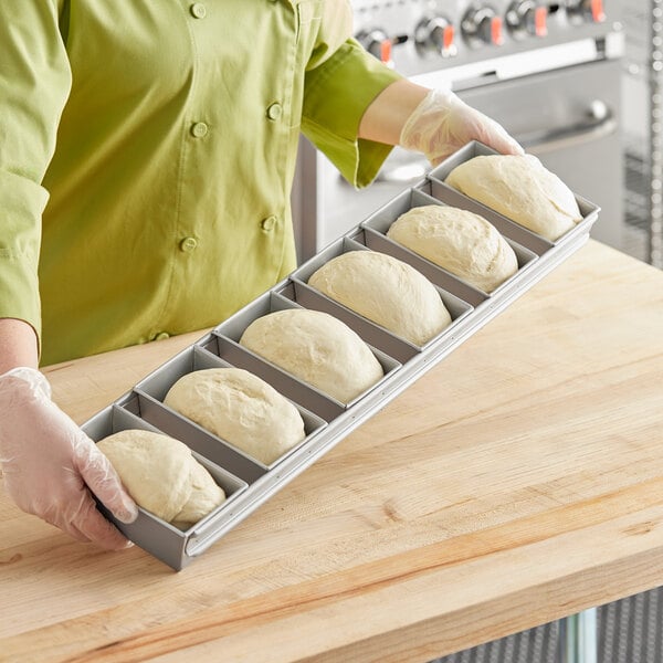 Baker's Mark 8 Compartment Non-Stick Carbon Steel Mini Bread Pan - 5 oz.  Capacity, 3 5/8 x 2 3/8 x 1 3/8 Cavities