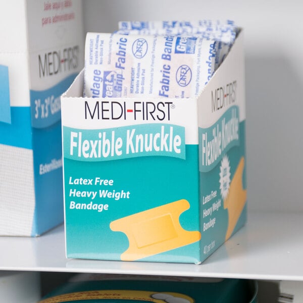 A box of Medique woven knuckle bandages on a shelf.