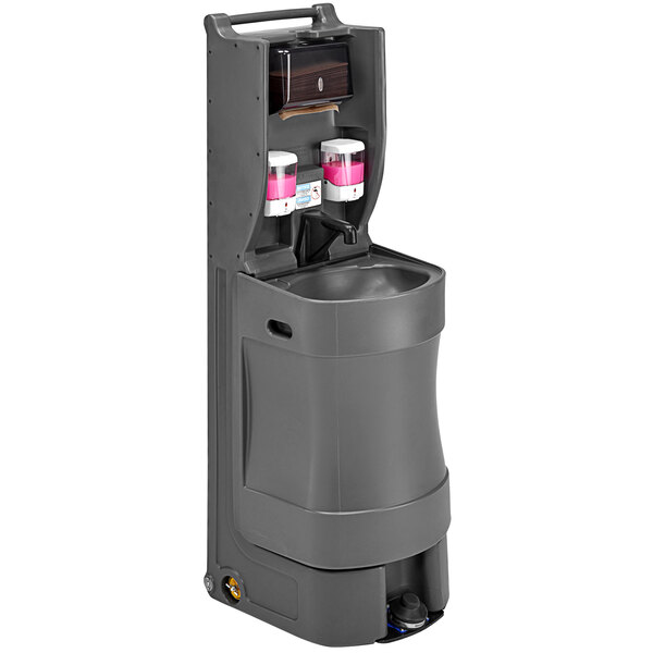 A gray rectangular Cambro mobile handwash station with a water dispenser and pink and white liquid dispensers.
