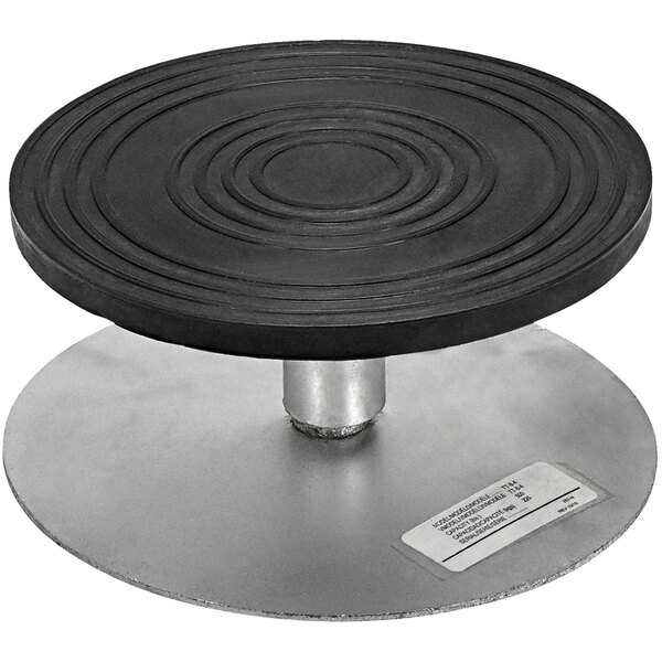A black circular Turntable with a metal base.