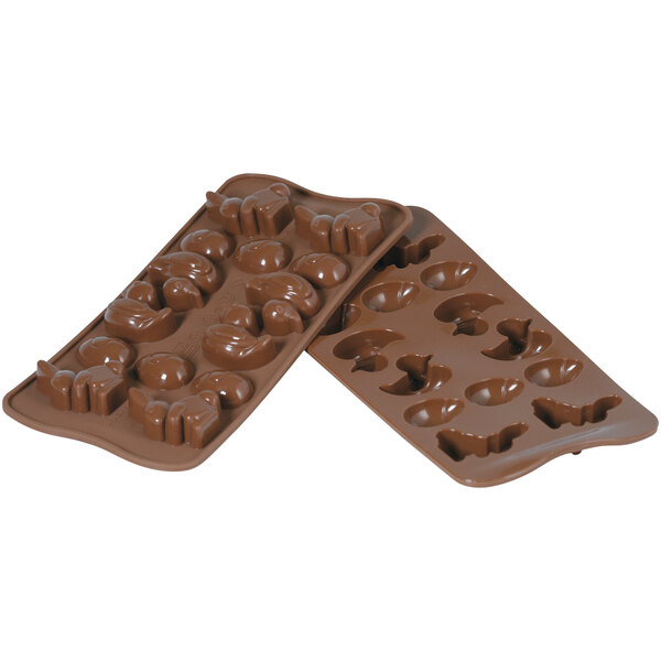 A Silikomart brown silicone chocolate mold with 14 different shapes.