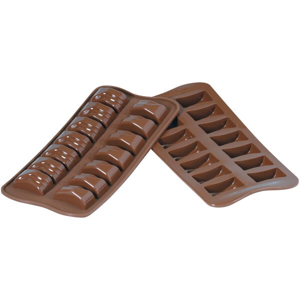 A Silikomart Jack Brown silicone chocolate mold filled with chocolate bars.