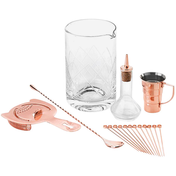 A Barfly copper cocktail tool kit on a counter.