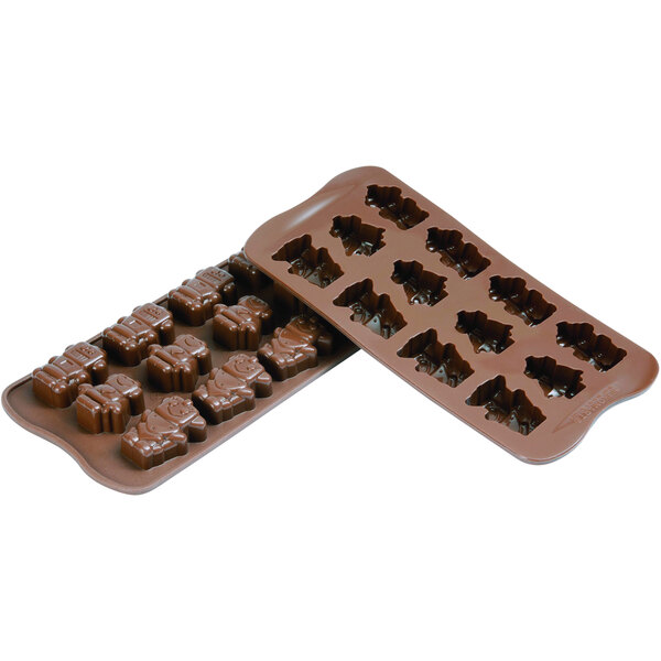 A Silikomart brown silicone chocolate mold with robot shapes.