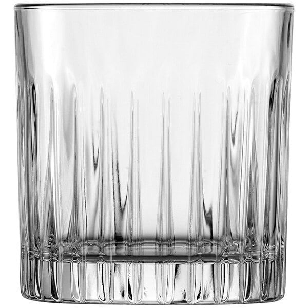 A clear Fortessa Stage Rocks glass with a ribbed bottom.