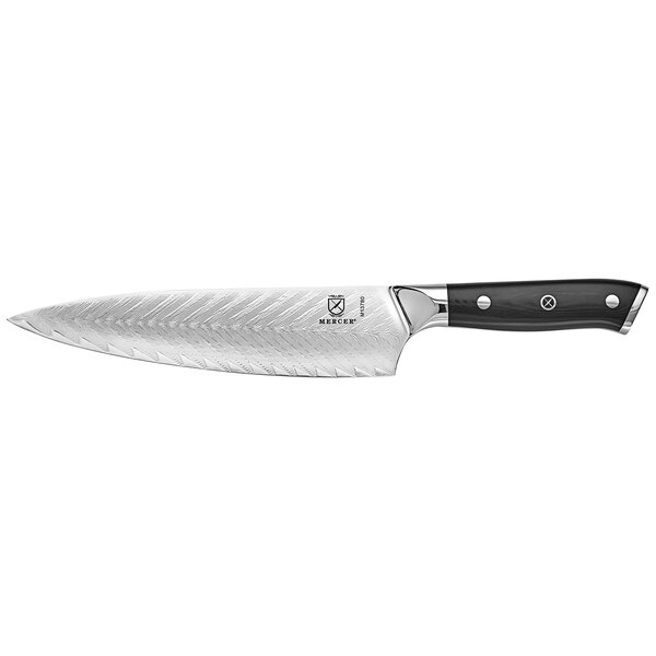 A Mercer Culinary Damascus chef knife with a black handle.