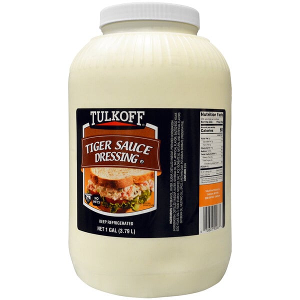 A white jar of Tulkoff Tiger Sauce dressing with a black label.