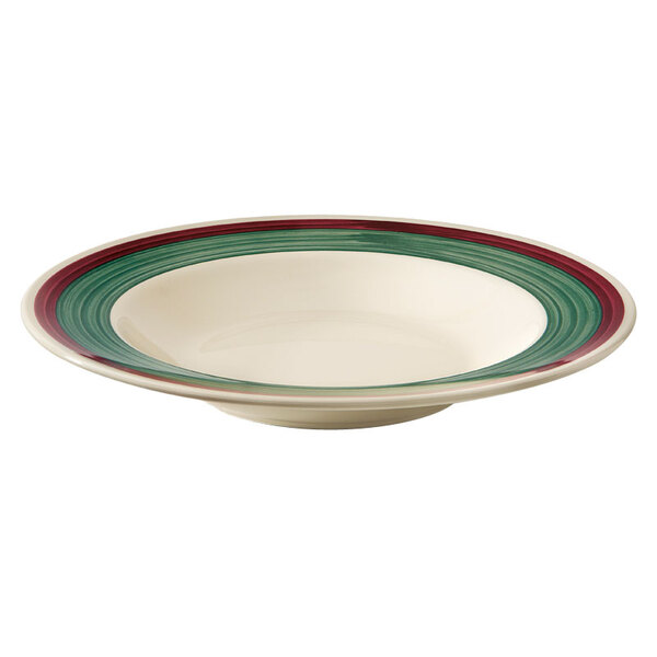 A white bowl with a curved line and red and green stripes.