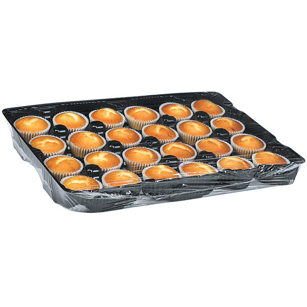 A tray of Rich's Allen white cupcakes in plastic wrappers.