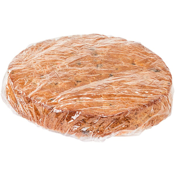 A Rich's Allen round carrot cake wrapped in plastic.