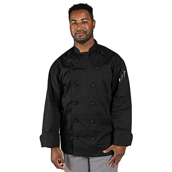 A man wearing a black Uncommon Chef long sleeve chef coat with white buttons.