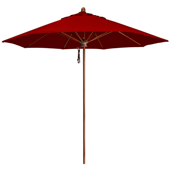 A close-up of a red California Umbrella with a simulation wood aluminum pole.