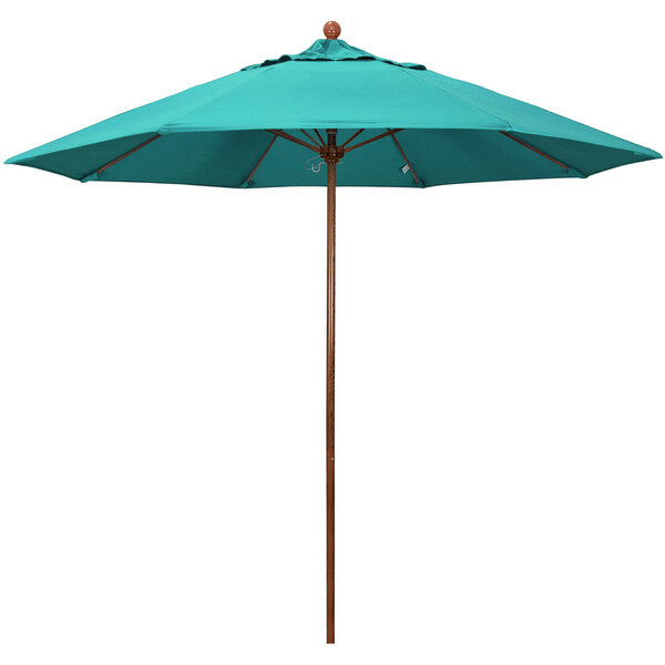 A teal California Umbrella with a wooden pole and an Aruba Sunbrella canopy.
