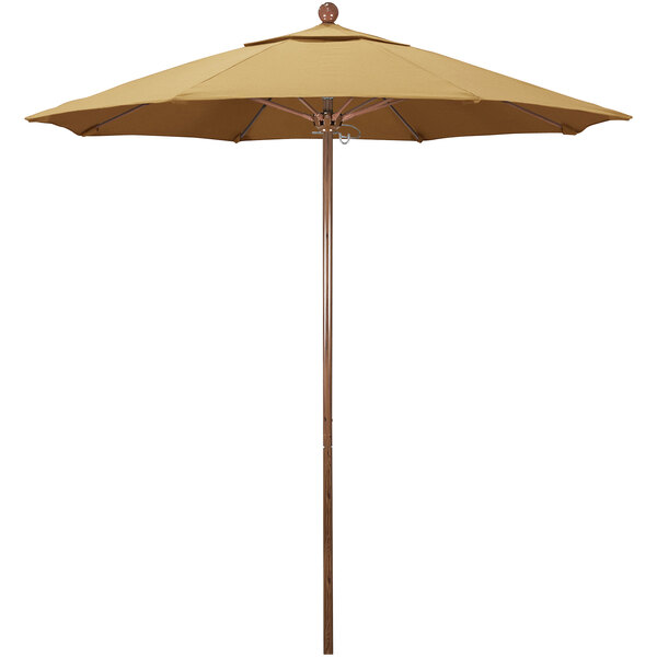 A close-up of a California Umbrella with a Sunbrella wheat fabric canopy and an American oak aluminum pole.