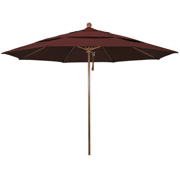 A close-up of a California Umbrella with a burgundy canopy and American oak pole.