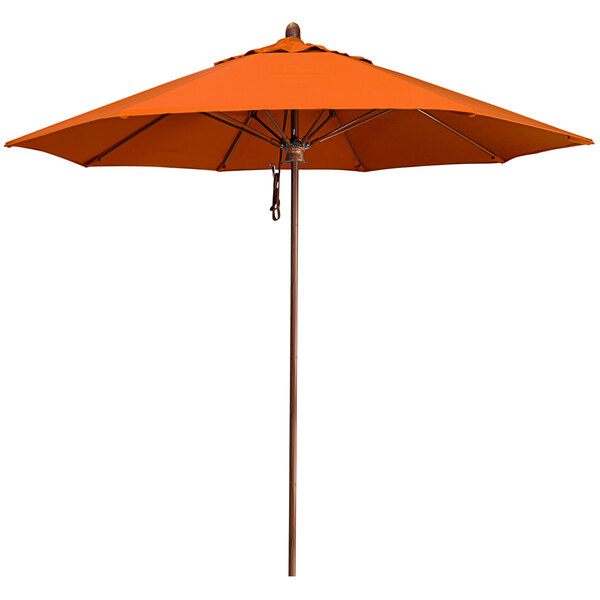 An orange California Umbrella with a simulated wood pole and a Tuscan Sunbrella canopy.