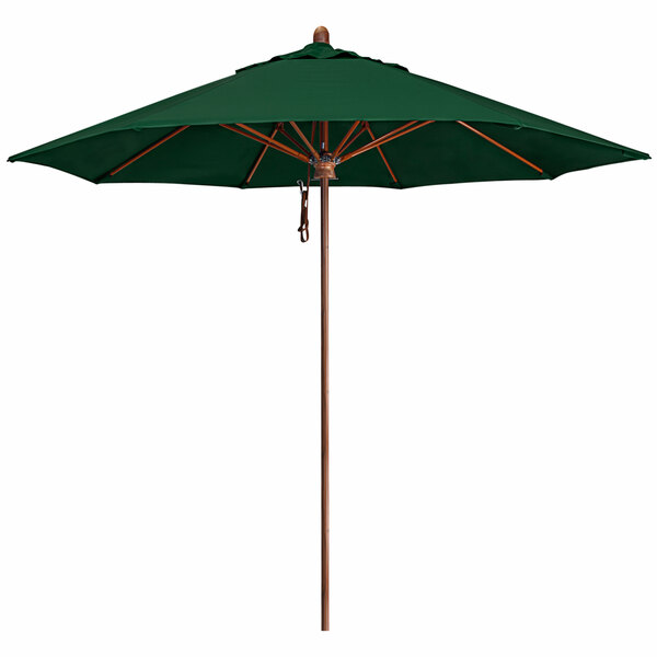 A California Umbrella green canopy with a simulated wood pole.