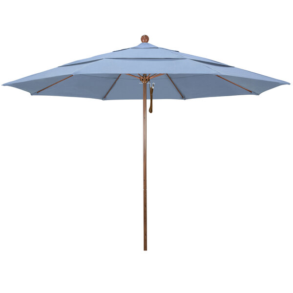 A close-up of a California Umbrella with an American Oak pole and blue Sunbrella fabric.