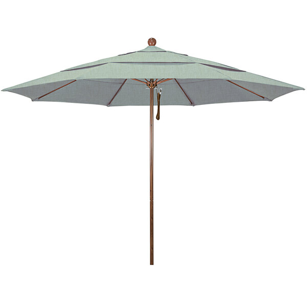A close-up of a California Umbrella with a green Sunbrella canopy and American Oak pole.