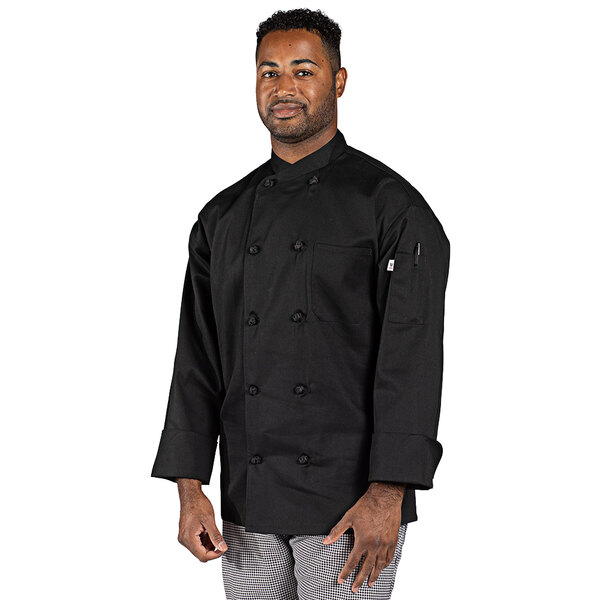 A man wearing a Uncommon Chef black long sleeve chef coat.
